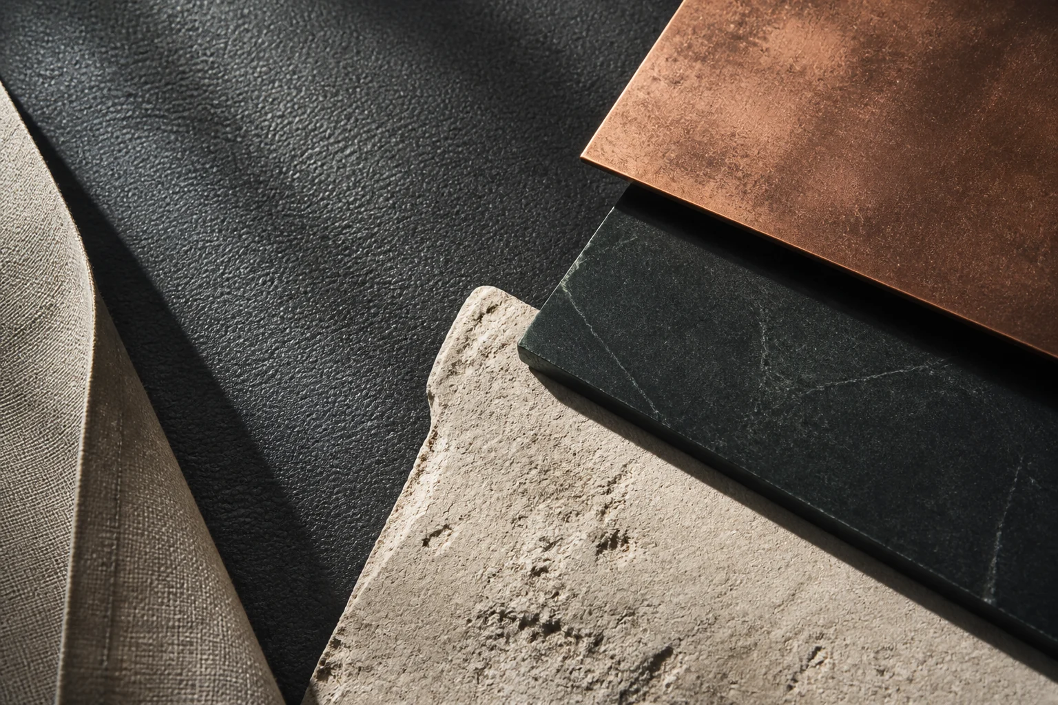 Tactile study of leather, copper, limestone and dark stone